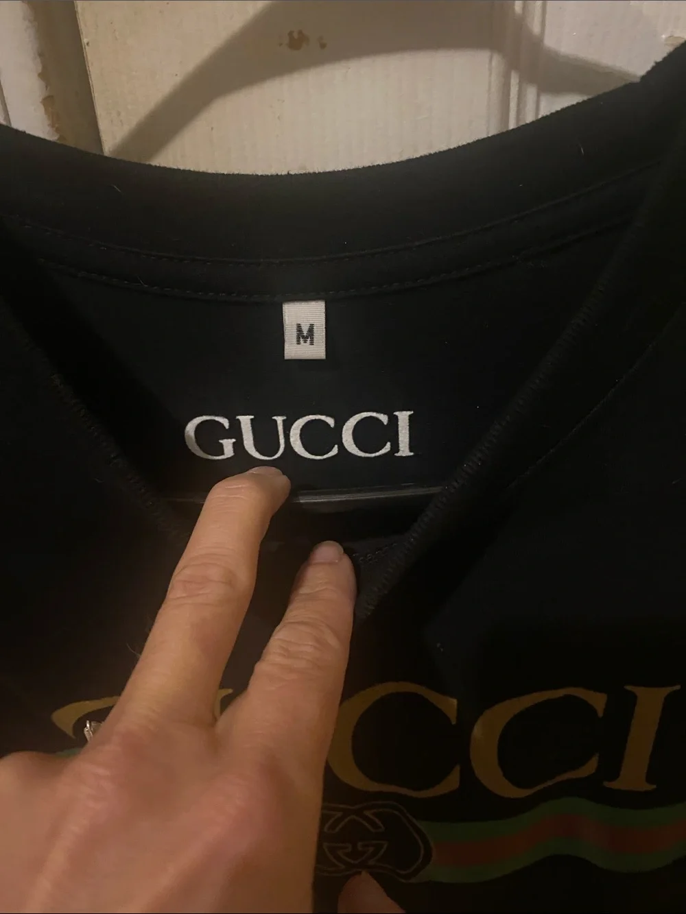 Gucci Black Tee with Gold Logo and Green-Red Stripe
